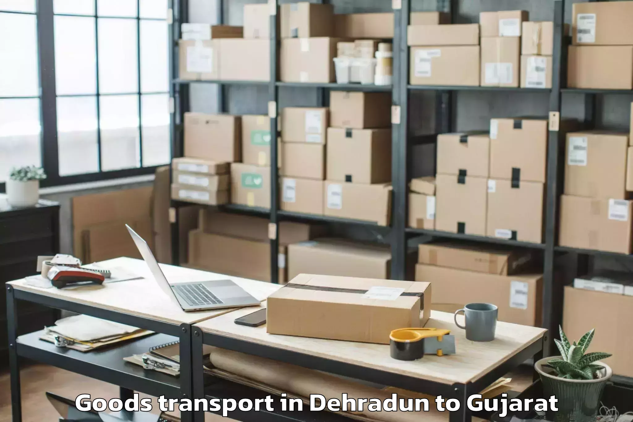 Expert Dehradun to Marwadi University Rajkot Goods Transport